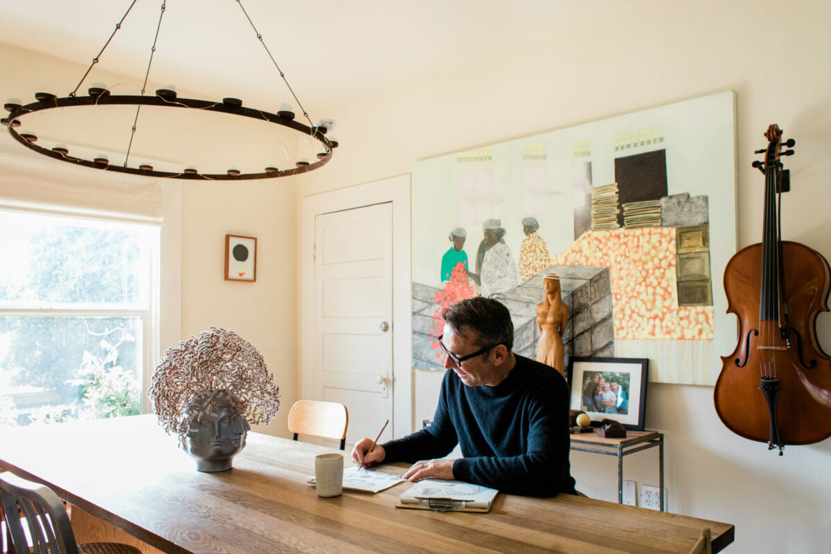 Sébastien Pochan sketches in the dining room of his Healdsburg home. (Eileen Roche/For Sonoma Magazine)