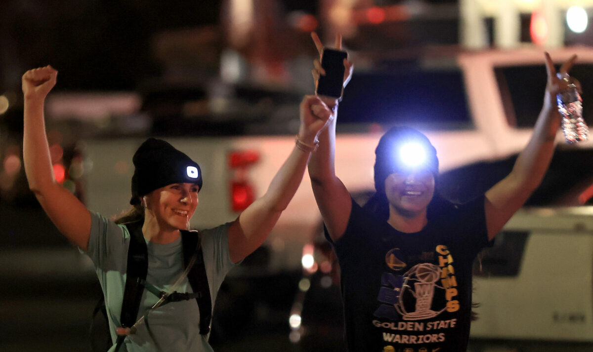 Rachel Seitz, left, and Emi Gutierrez, both of Santa Rosa, finish their night run during Healdsburg Running Co's run and a meal afterward at Lepe's Taqueria in Santa Rosa, Thursday, Feb. 9, 2023. (Kent Porter / The Press Democrat) 2023