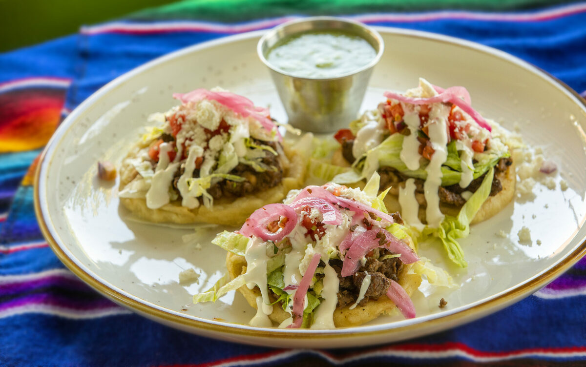 Sopesitos topped with choice of meat, refried beans, lettuce, pico de gallo, quesof resco, pickled onions and avocado from Cielito Lindo restaurant in Santa Rosa. (John Burgess/The Press Democrat)