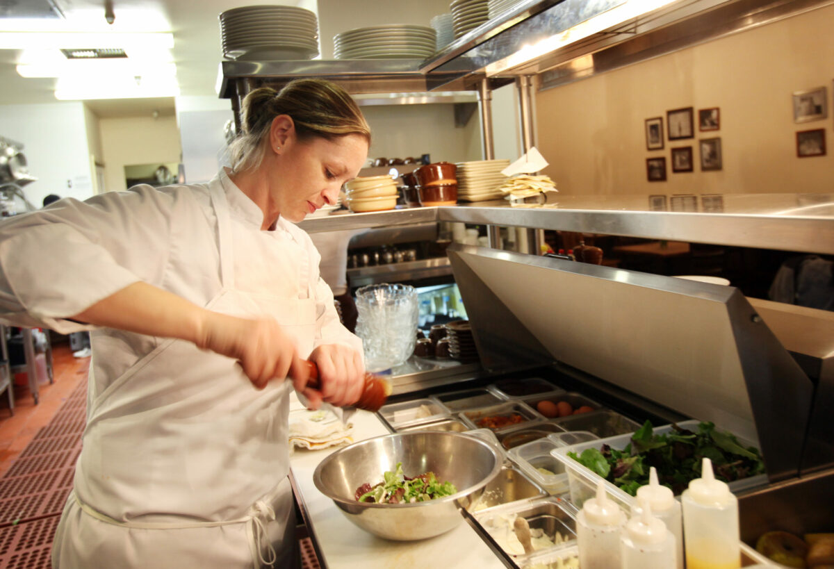 Jennifer McMurry of Viola Pastry Boutique in Montgomery Village puts together a salad to go with her Croque Madame.