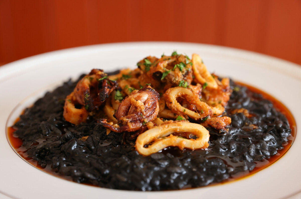 Arroz Negro, made with grilled squid, pimento, and lemon, at The Redwood in Sebastopol on Friday, February 24, 2023. (Christopher Chung/The Press Democrat)
