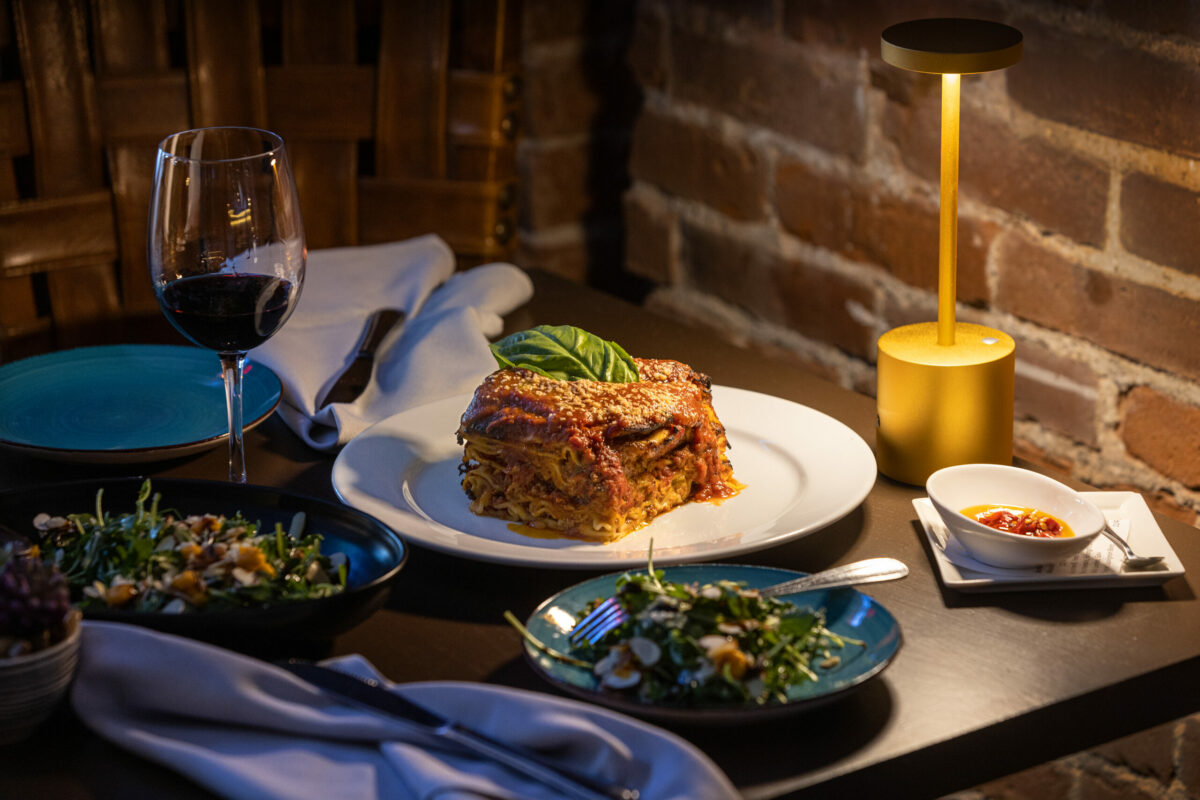 The enormous Lasagna with a Stagionale salad of arugula, roasted butternut squash puree, sliced almonds., topped with pecorino cheese, in an orange mustard and Extra Virgin Olive Oil dressing from L'Oro di Napoli in downtown Santa Rosa. (John Burgess/The Press Democrat)