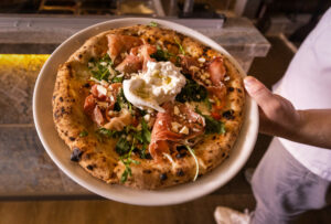 The Primavera pizza with mozzarella, fresh cherry tomato, arugula, creamy burrata cheese, prosciutto San Daniele and EVOO from L'Oro di Napoli in downtown Santa Rosa, March 24, 2023. (John Burgess/The Press Democrat)