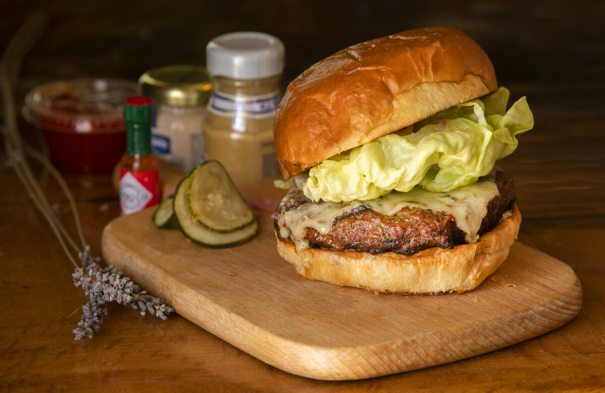 The Tell Burger with cheese from the William Tell House in Tomales. (John Burgess/The Press Democrat)