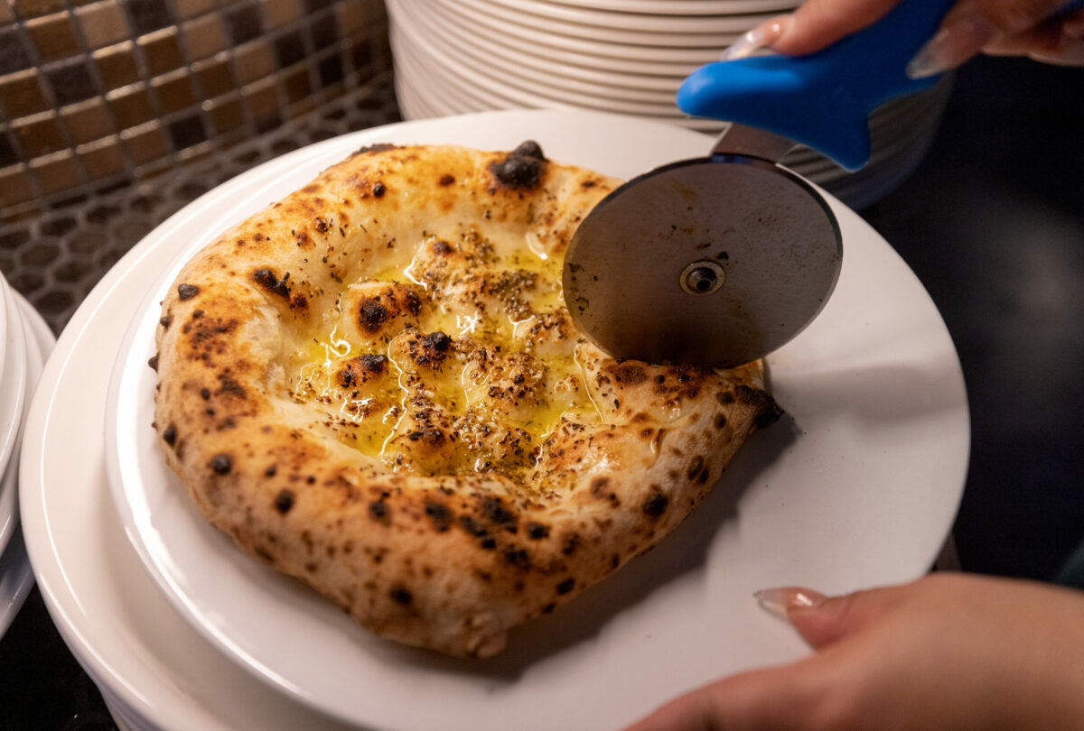 Focaccia All' Aglio, Napoletan garlic bread with oregano and lots of EVOO from L'oro di Napoli in downtown Santa Rosa March 24, 2023. (John Burgess/The Press Democrat)