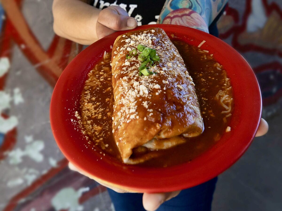 Second-generation owner Kate Bruno with the Big Ranch carne asada burrito from Juanita Juanita in Sonoma. (John Burgess/The Press Democrat)
