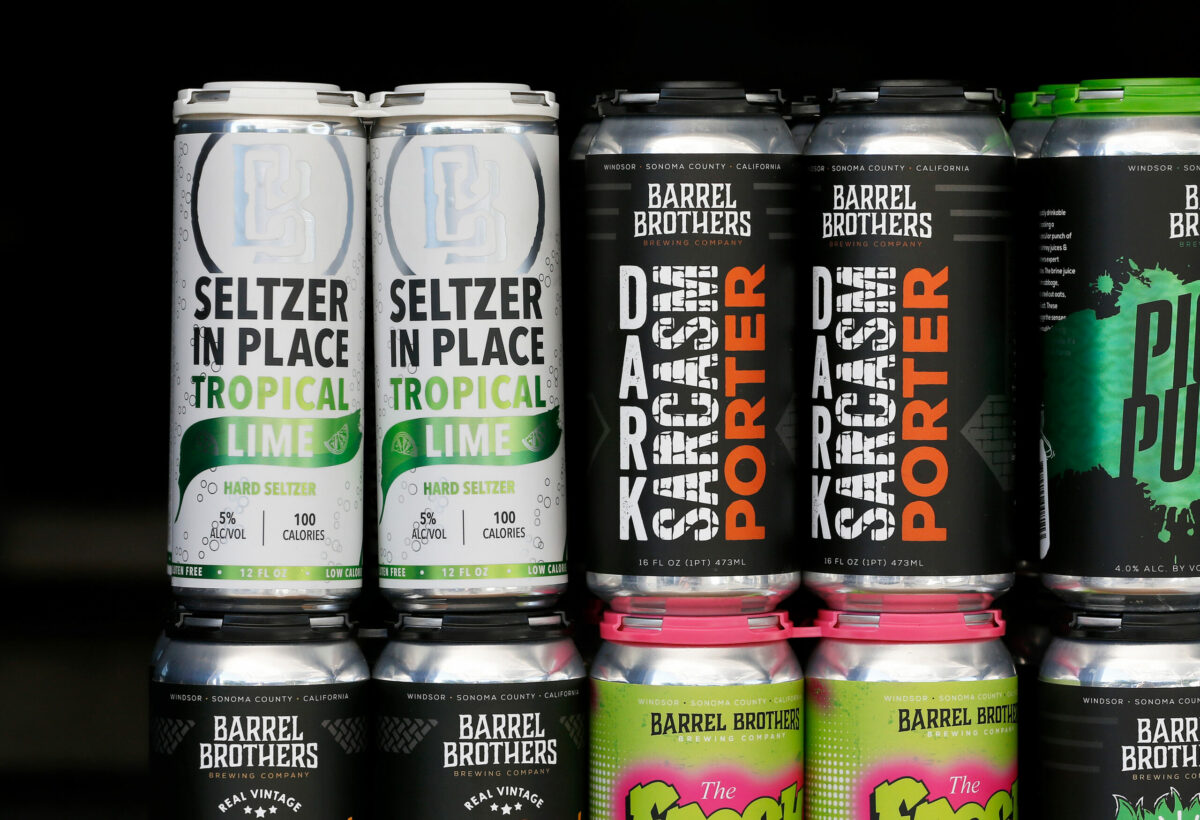 Canned four-packs of Seltzer in Place Tropical Lime hard seltzer, at left, by Barrel Brothers Brewing Company are displayed at the brewery's to-go station in Windsor, California, on Thursday, August 13, 2020. (Alvin A.H. Jornada / The Press Democrat)