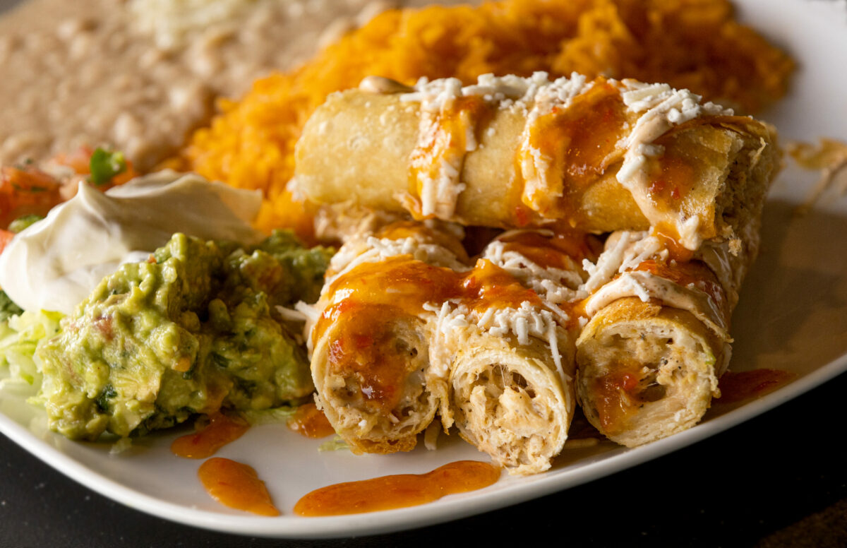 Flautas Platter has rolls filled with shredded chicken and cheese, drizzled with chipotle aioli and a side of jalapeño and pineapple jelly, at El Milagro in Cloverdale. (John Burgess/The Press Democrat)