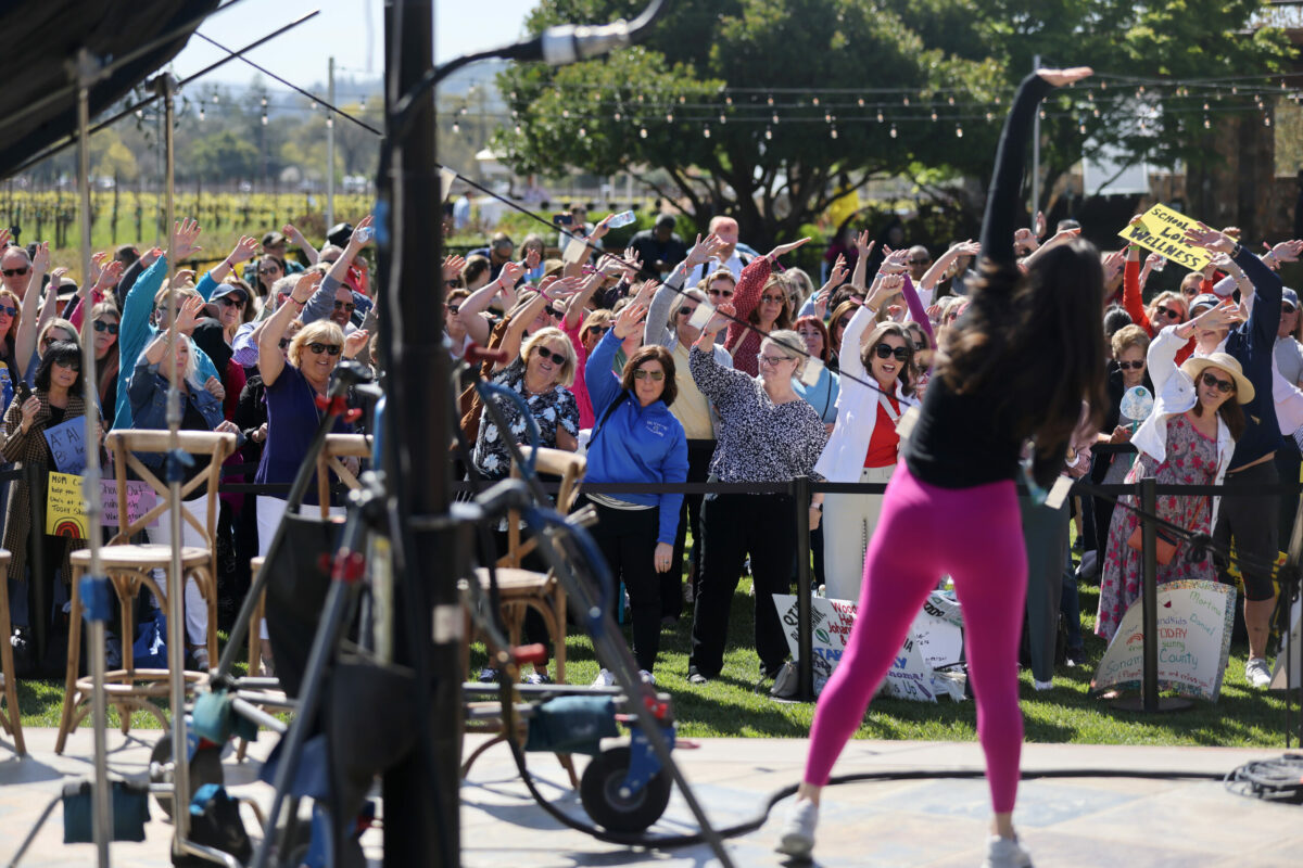 Fans get warmed up before the start of a taping of NBC's "Today" show at St. Francis Winery in Santa Rosa, Thursday, April 20, 2023. (Beth Schlanker / The Press Democrat)