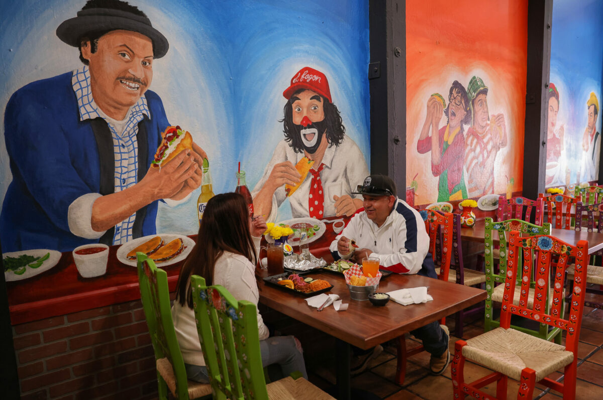 Isaac Yanez, right, and Guadalupe Martinez eat lunch at El Fogon Taco Shop in Santa Rosa on Friday, April 14, 2023. (Christopher Chung/The Press Democrat)