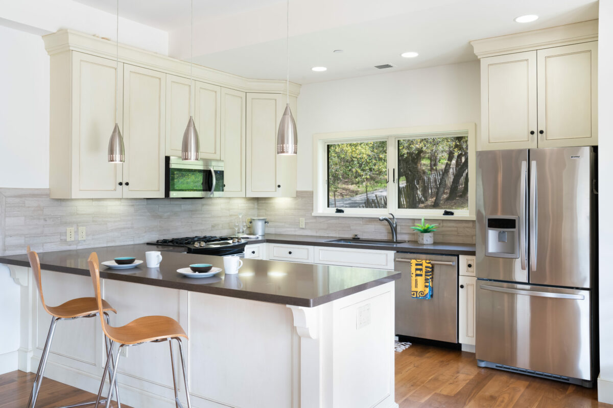 The property has a guesthouse complete with a kitchen, bathroom and french doors that open up to a seating area on a stone patio. (Ned Bonzi)