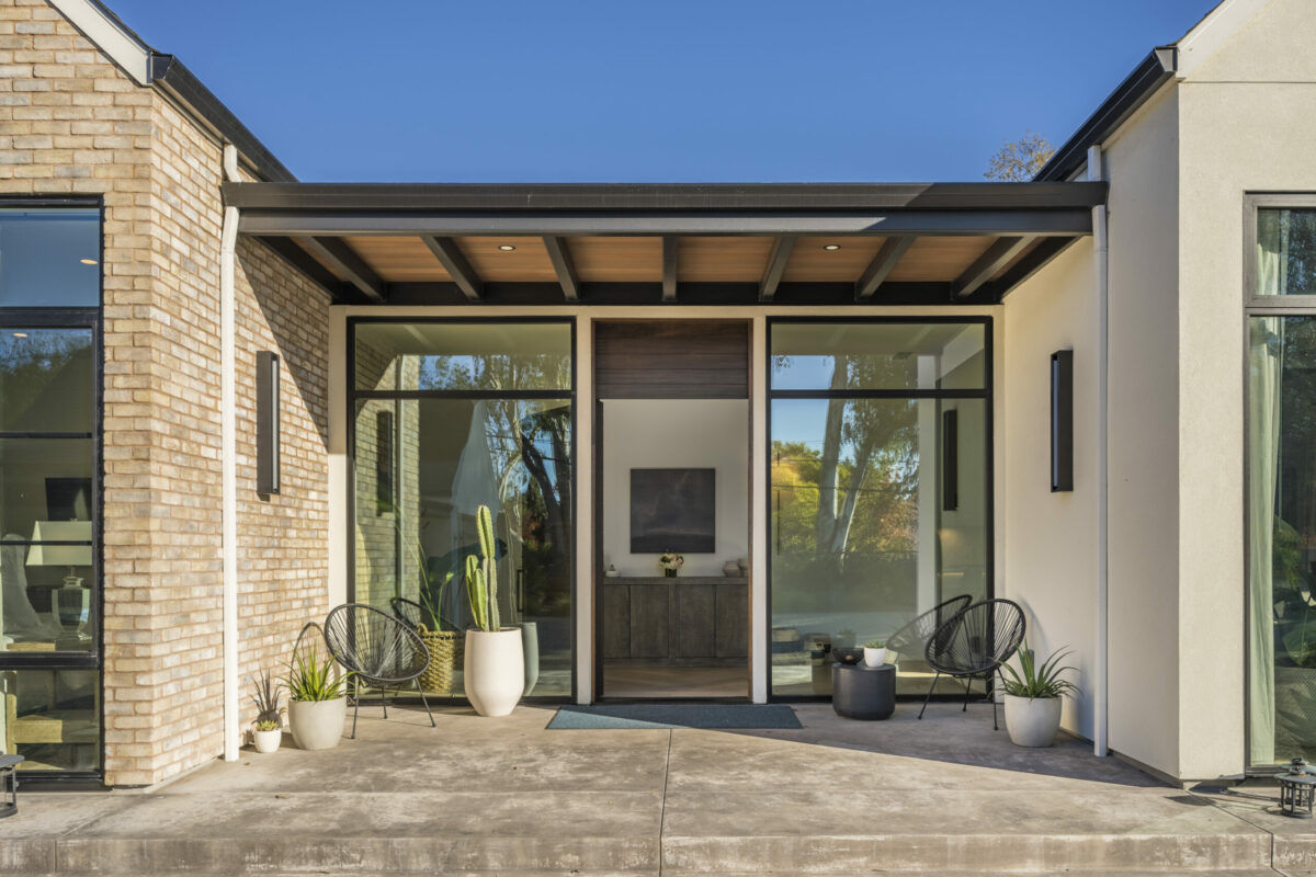 The front entry at Six Palms gets lots of light via floor to ceiling windows.(Provided by Carol Sebastiani of Sotheby's International Realty)
