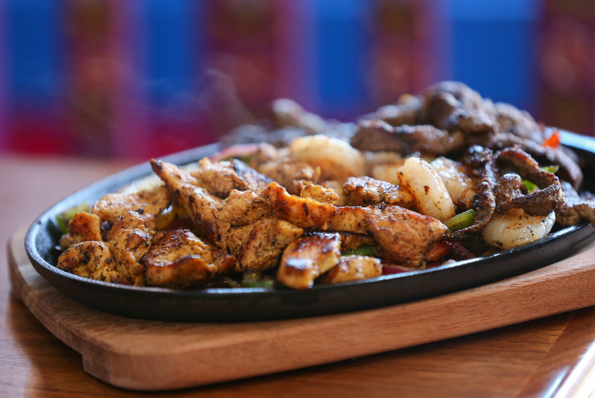 Fajitas Mix, with chicken, shrimp, and steak, at El Fogon Taco Shop in Santa Rosa on Friday, April 14, 2023. (Christopher Chung/The Press Democrat)