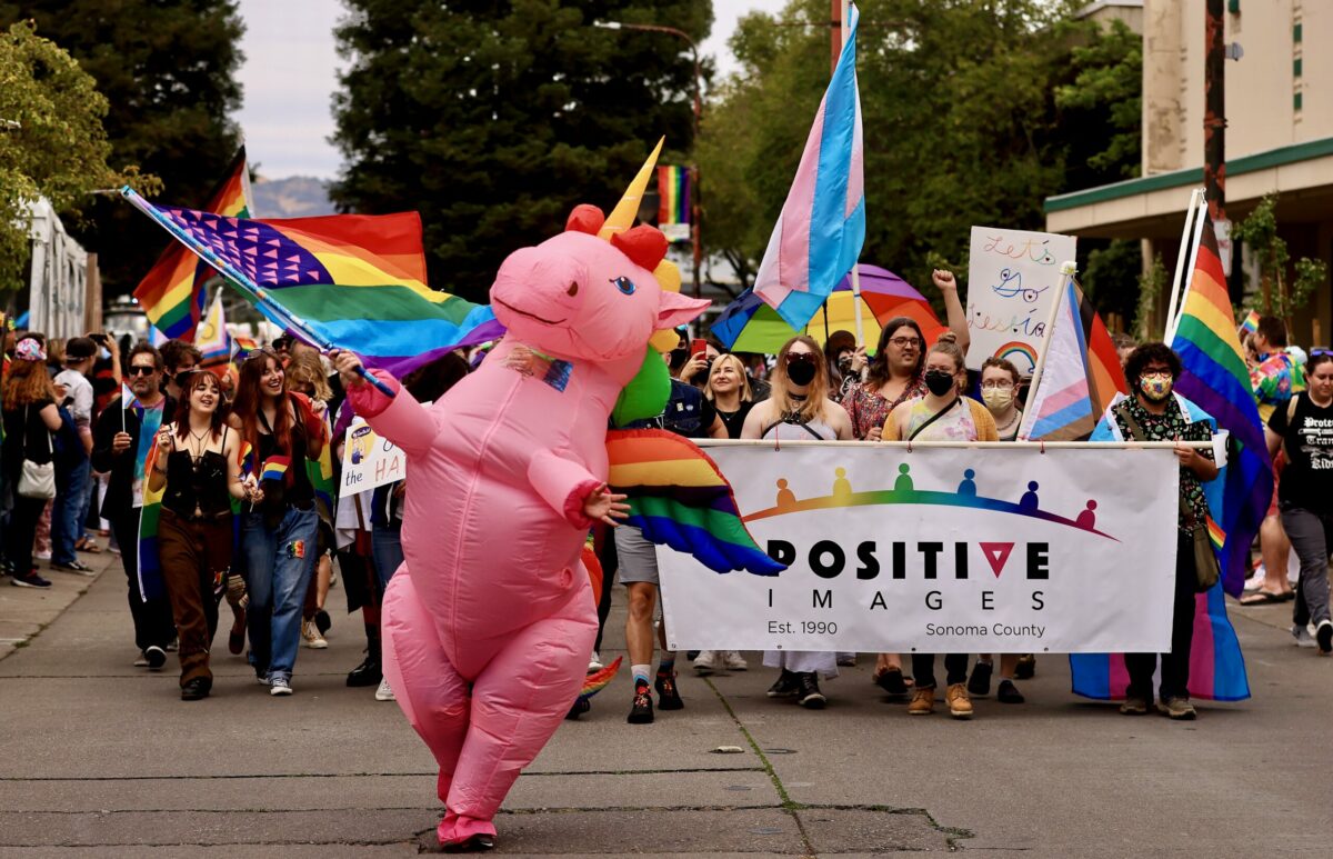 Positive Images, a nonprofit organization which provides support, advocacy, and education to Sonoma County's LGBTQIA+ community, participate in the Sonoma County Pride Parade and Festival in downtown Santa Rosa, Saturday, June 4, 2022. (Kent Porter / The Press Democrat) 2022