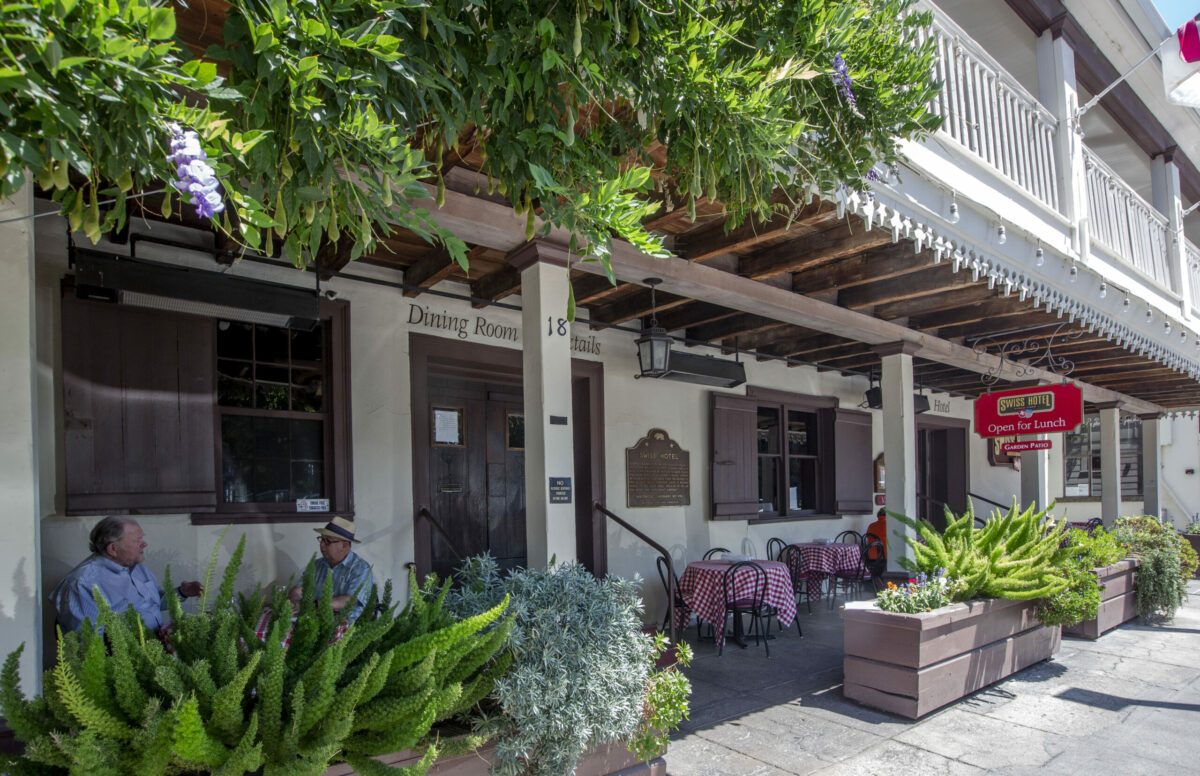 A few tables on the front porch of the Swiss Hotel allow for good people watching on West Spain Street while dining or stopping by for a glass of wine and a dessert. Photo taken on Thursday, August 4, 2022. (Robbi Pengelly/Index-Tribune)