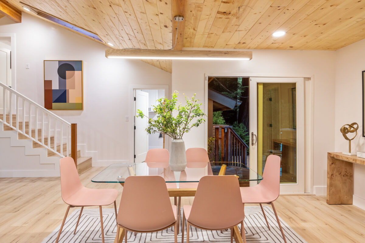 The warm woodsy look is punctuated with pinks and greens in the tiles and furniture. (Open Homes Photography)