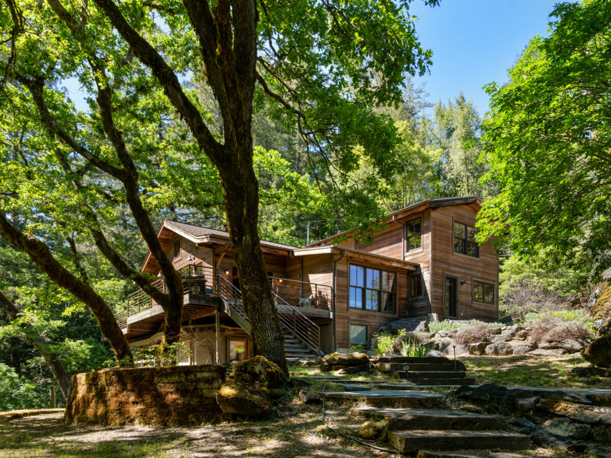 The cedar-clad home blends well into the natural setting. (Lunghi Studios)