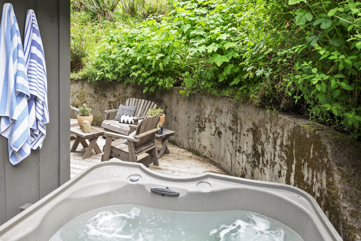 Outside the home are plenty of paved spots to drink in the setting like seating areas, a picnic bench and a hot tub. (Brian McCloud Photography)