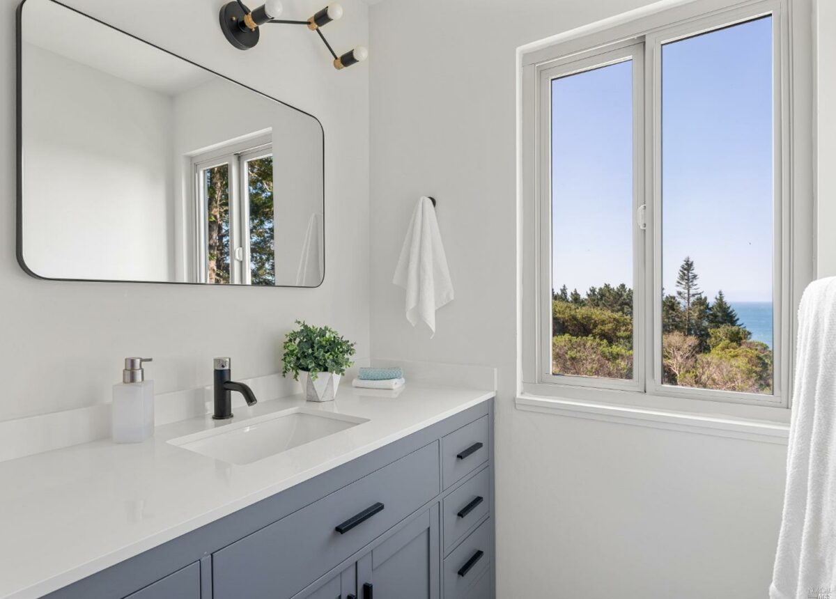 This updated bathroom enjoys an ocean view. (Bill Oxford Photography)