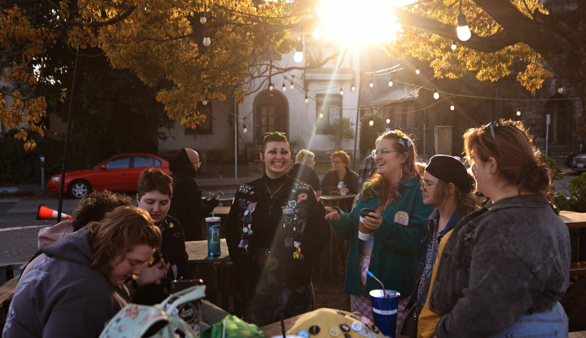 At Brew Coffee and Beer House in Santa Rosa, people gather for Transgender Day of Visibility, Friday, March 31, 2023, including Eloria Smith, who identifies as nonbinary, third from right, and transgender man Teddy Fast (he/him), second right. (Kent Porter / The Press Democrat) 2023