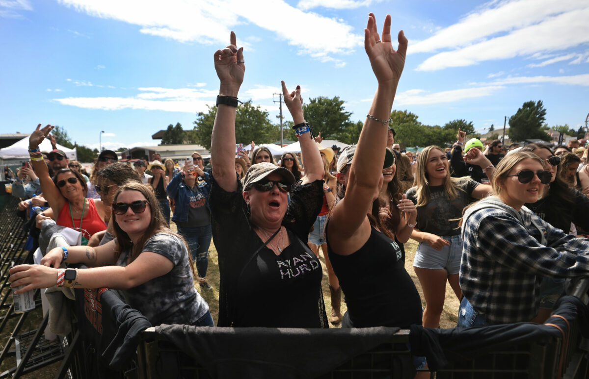 Lizzy Pedersen, left, of Chino and Tiffany Benton of San Jose cheer on Ryan Hurd, Friday, June 17, 2022 during the country Summer Music Festival in Santa Rosa. (Kent Porter / The Press Democrat) 2022