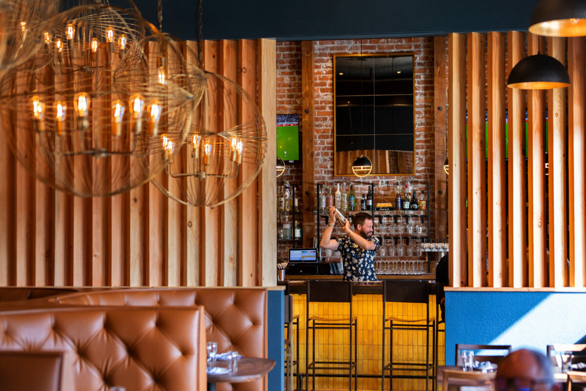 Bartender Josh Sontag mixes up a tasty drink behind the bar at Goldfinch restaurant in Sebastopol. (John Burgess / The Press Democrat)