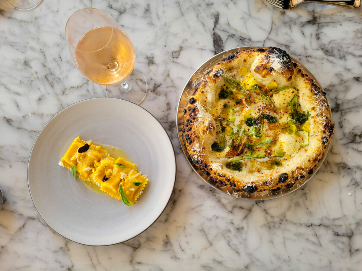 Corn agnolatti and white pizza with squash blossom, zucchini and riccota at Molti Amici in Healdsburg. (Heather Irwin)