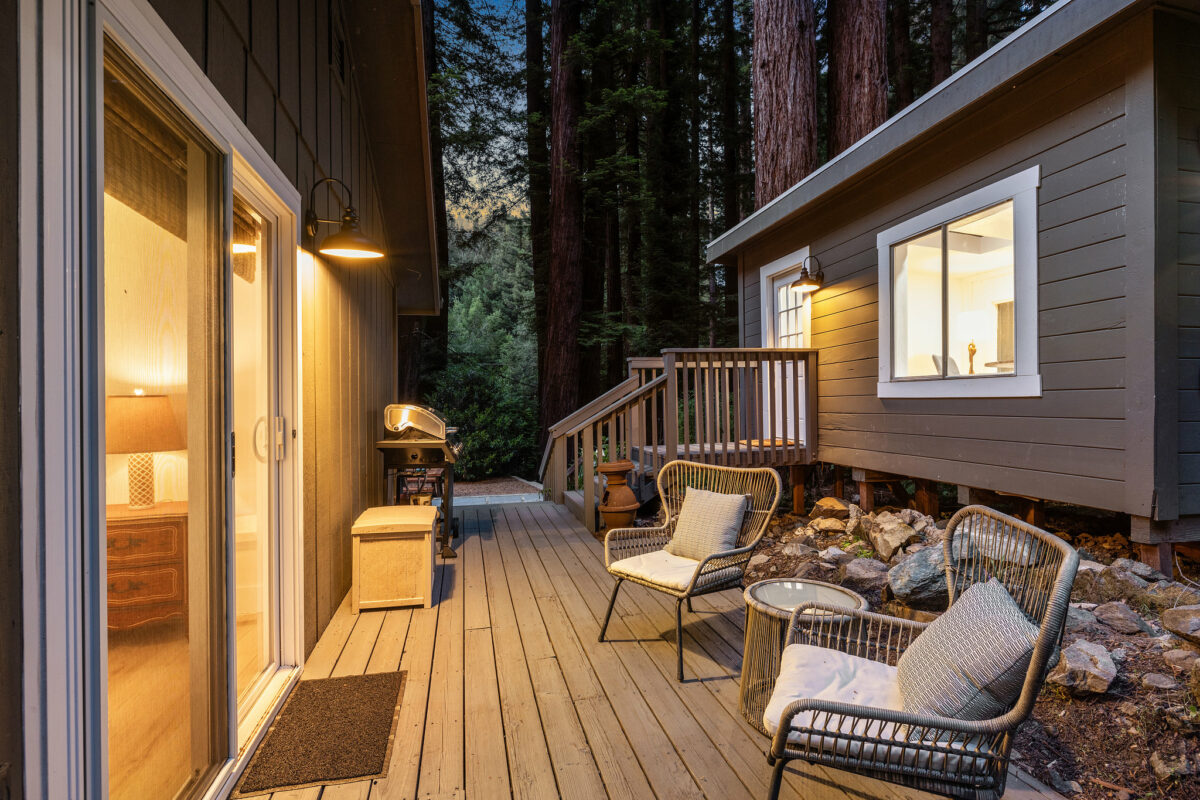 A deck between the home an office space offers additional seating and more redwood views. (Open Homes Photography)
