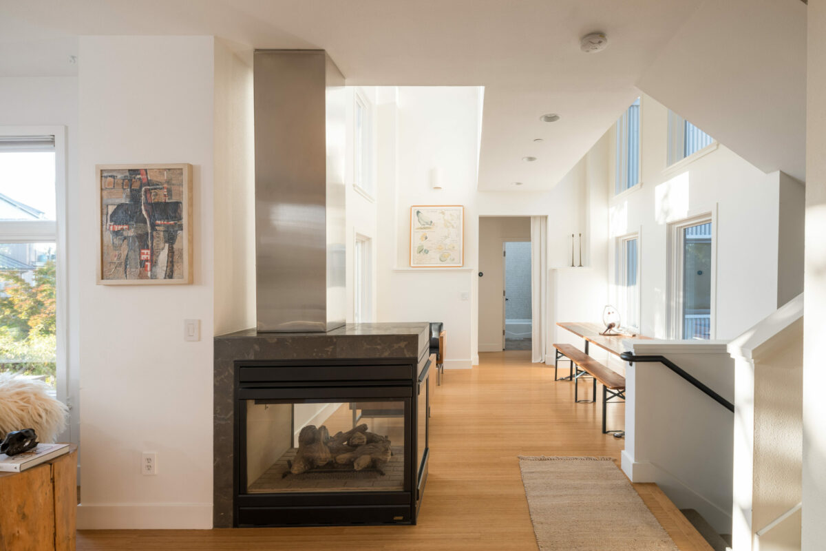 The breezeway and dining area has 18-foot ceilings and a three-sided fireplace. (Adam Potts)