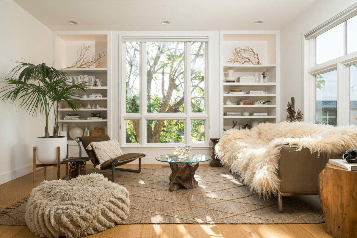 The seating area of the great room is bathed in light thanks to large windows. (Adam Potts)