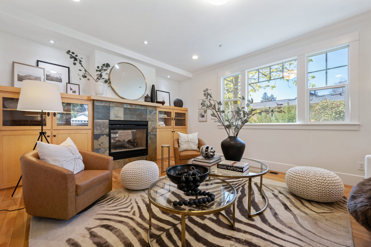 The living room has two-way fireplace it shares with the dining room. (Open Homes Photography)