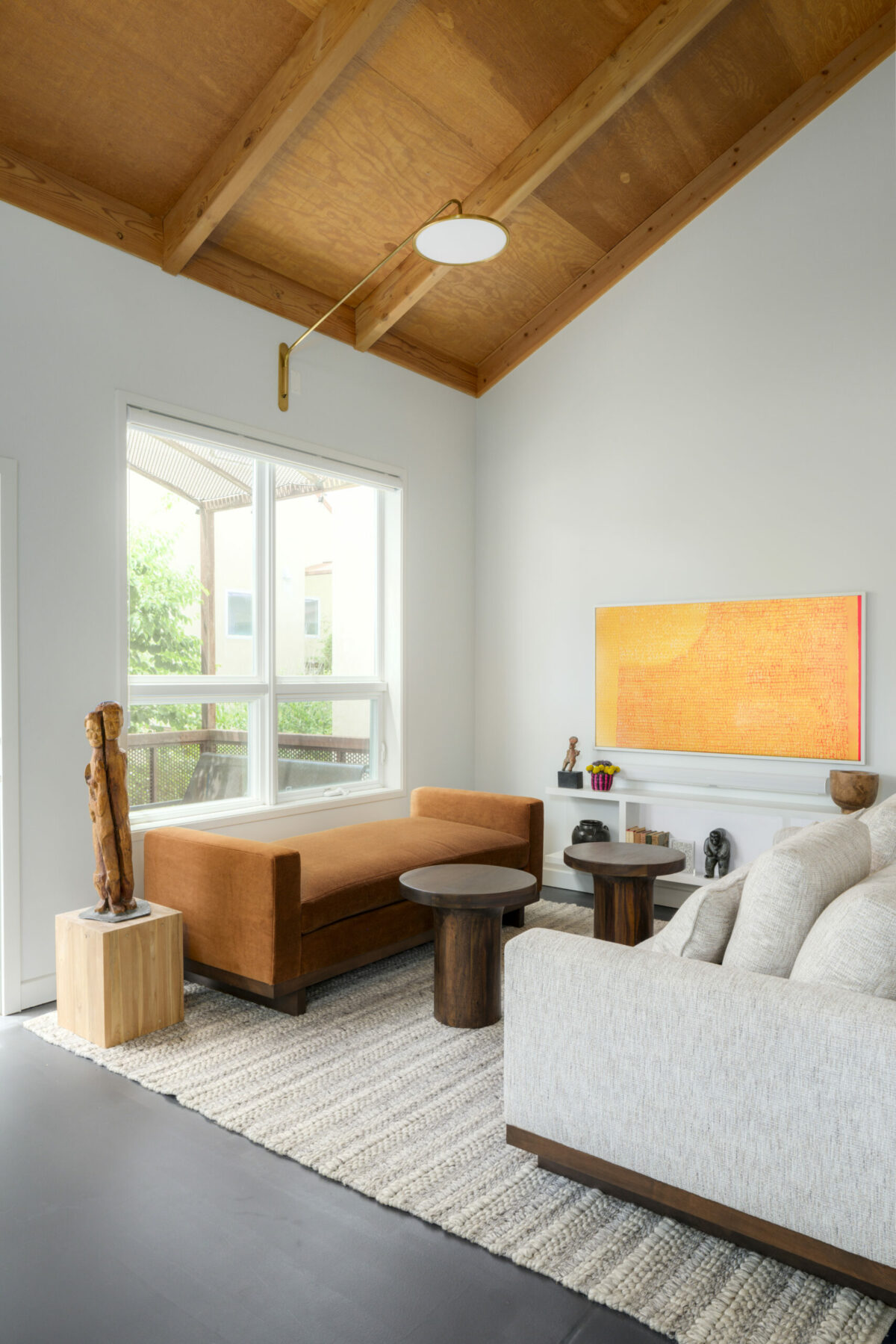 Whited out walls and cabinets provide contrast with the exposed wood pitched ceiling. (Christoper Stark)