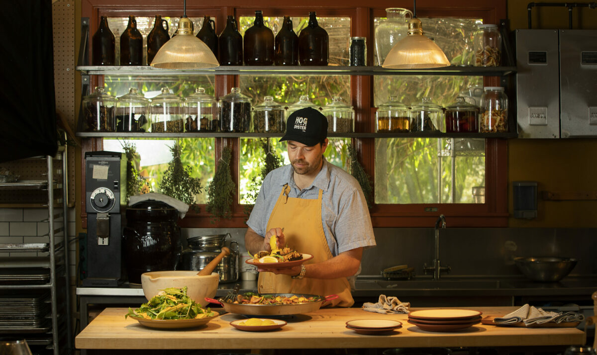 Chef Perry Hoffman serves up paella and a green salad in the kitchen at the Boonville Hotel in the Anderson Valley. (photo by John Burgess/The Press Democrat)