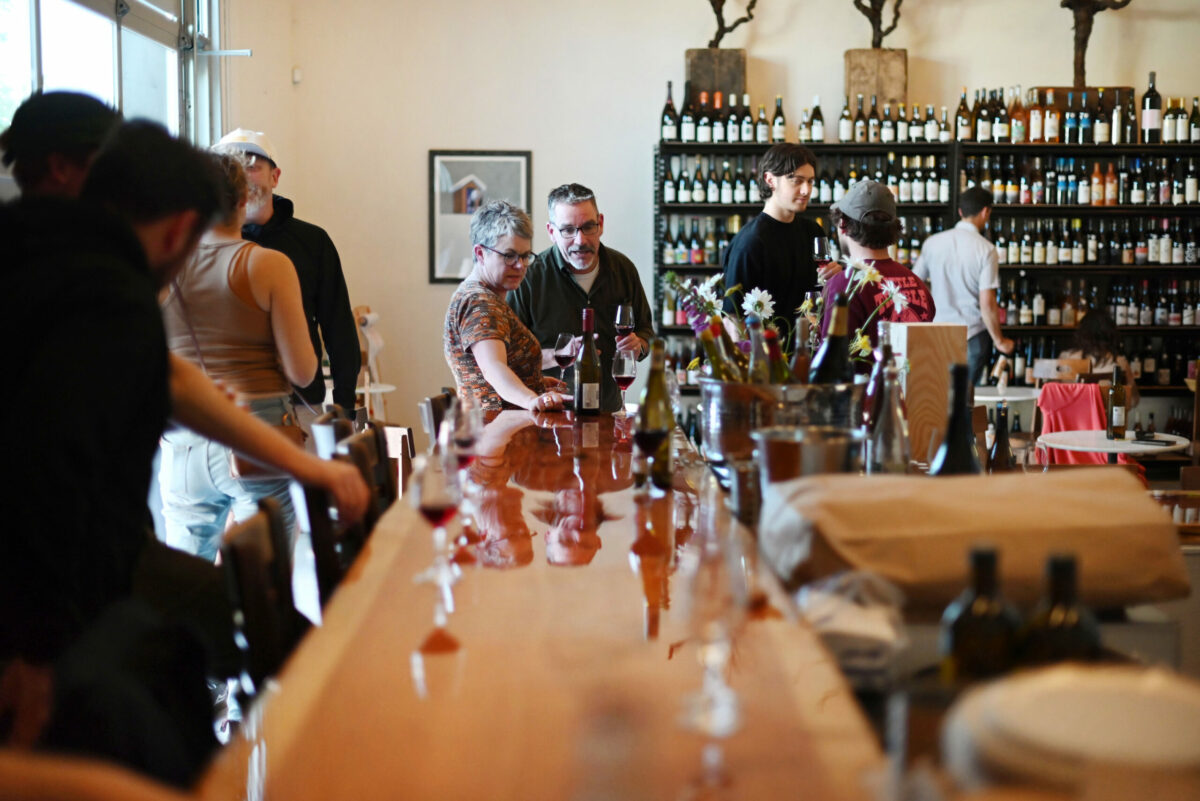 Kristen and Ted Talley, French wine importers, at the end of the bar, were at the friends and family soft opening at The Punchdown Natural Wine Bar + Bottle Shop on Friday, May 12, 2023, in the Barlow in Sebastopol. (Erik Castro / For The Press Democrat)