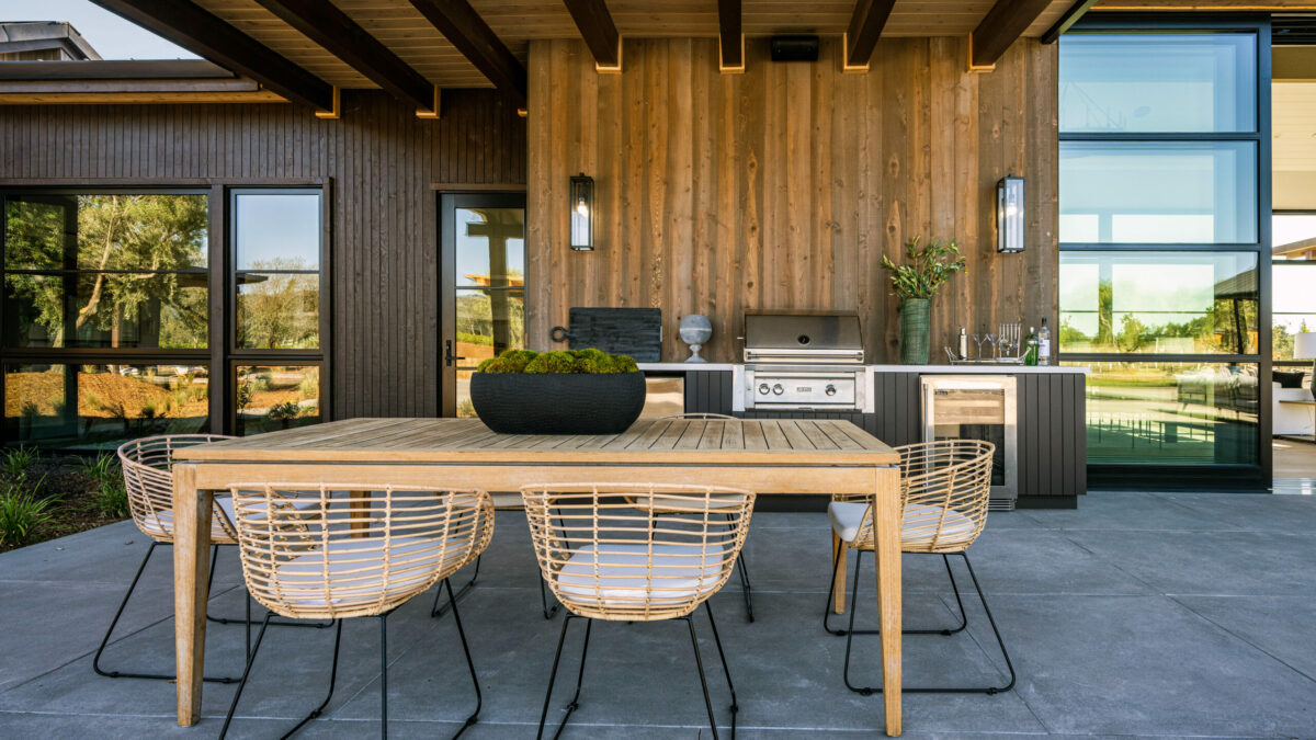 Outdoor kitchen and one of several seating areas. (Robert Vente / Sotheby’s International Realty)