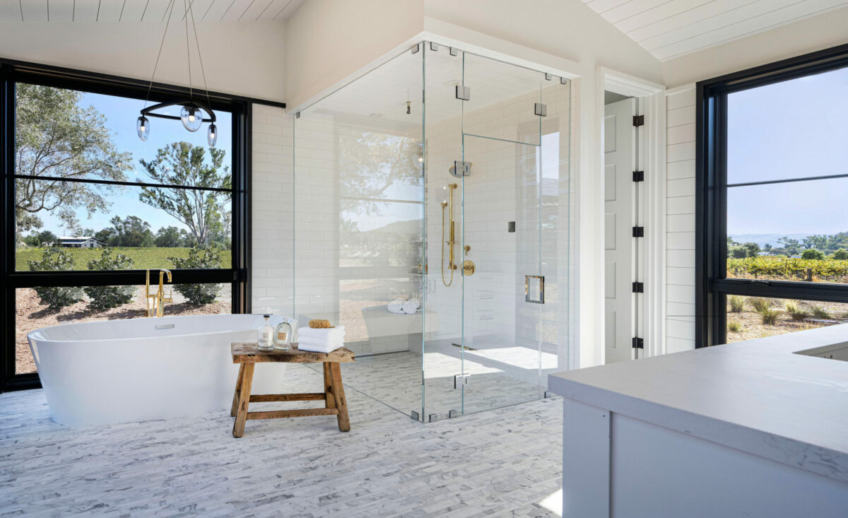 Stalwart finishes, shiplap and marble, stun subtly in this bathroom. (Robert Vente / Sotheby’s International Realty)