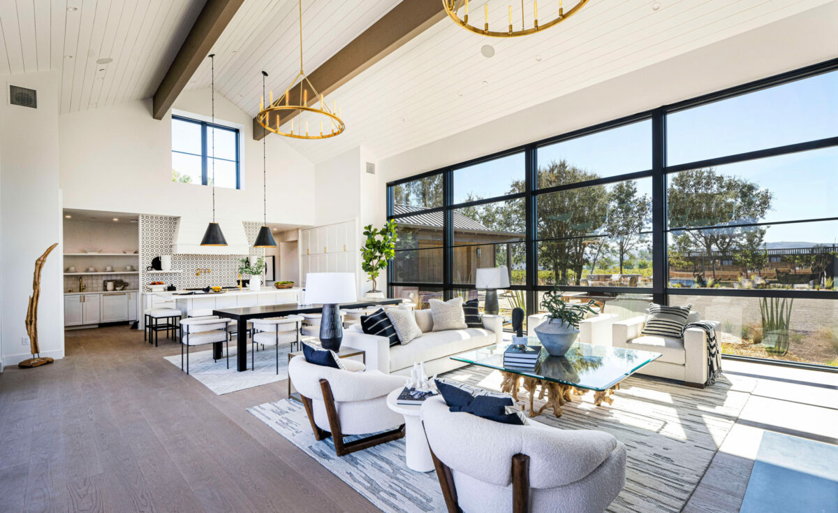The interior elements are visually subdued (mostly whites and woods) but classic (marbles and wide wood planks). (Robert Vente / Sotheby’s International Realty)