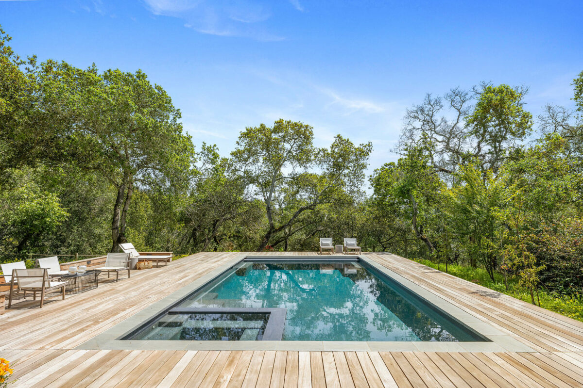 Decking artfully frames the pool and six-person spa. (Open Homes Photography)