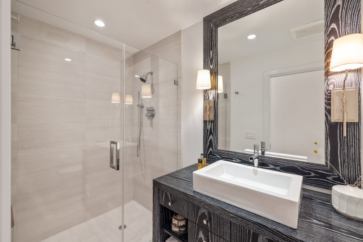 Rich textures are carried into the bathroom via this super-grainy vanity. (Open Homes)