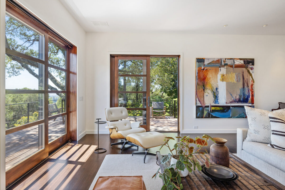 The living room enjoys views beyond the many French doors. (Open Homes Photography)