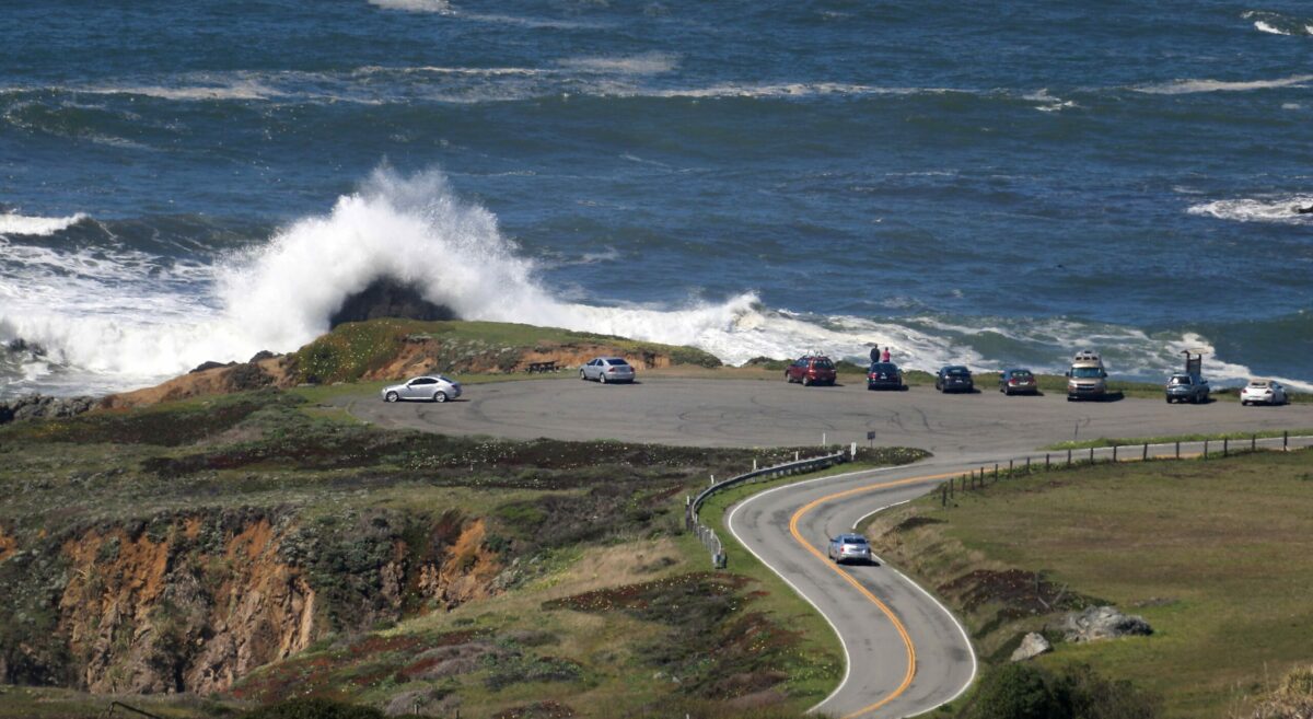 Waves crash ashore on Highway 1 at one of the many turnouts north of Bodega Bay. (Kent Porter / The Press Democrat) 