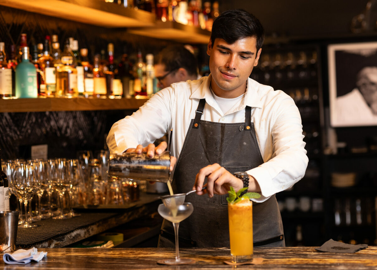 Bartender Adrian Sierra mixes up a cocktail in the upstairs bar at Goodnight’s Prime Steak + Spirits Friday, August 11, 2023 on the square in Healdsburg. (Photo John Burgess/The Press Democrat)