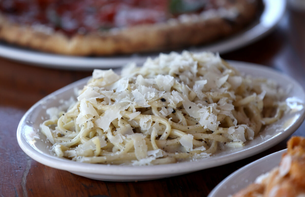 Bucatini pasta with a cacio e pepe sauce topped with pennyroyal cheese at Ciccio in Yountville, Monday, July 10, 2023. (Beth Schlanker / The Press Democrat)