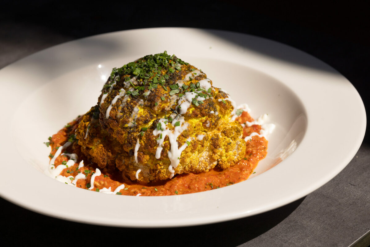 Whole Roasted Cauliflower Muhammara with za'atar, local olive oil, crème fraîche and toasted walnuts from Goodnight’s Prime Steak + Spirits Friday, August 11, 2023 on the square in Healdsburg. (Photo John Burgess/The Press Democrat)