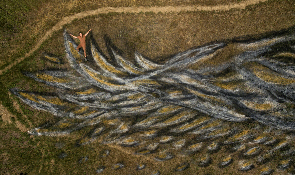 Earth artist Kelsi Anderson who paints artworks with natural pigments right into the landscape that are ephemeral and disappear with wind and rain and grass, shows off their most recent work in Green Valley west of Sebastopol. May 23, 2023. (Chad Surmick / The Press Democrat)