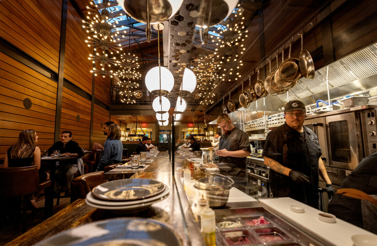 For those who like to watch a kitchen at work, the long counter is available for dining at Goodnight’s Prime Steak + Spirits Friday, August 11, 2023 on the square in Healdsburg. (Photo John Burgess/The Press Democrat)