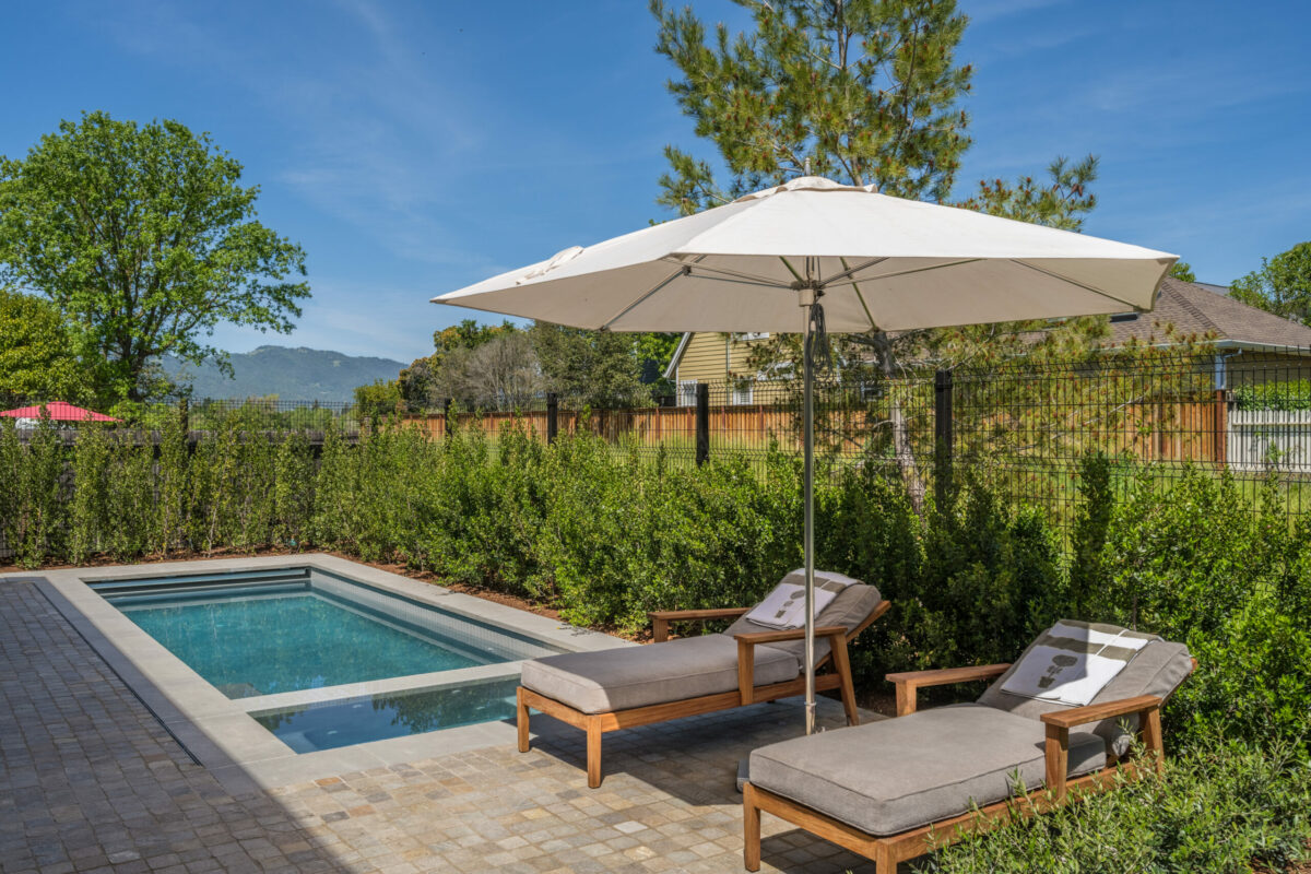 A lounging area enjoys privacy thanks to a growing hedge.(Paul Rollins for Sotheby’s International Realty)