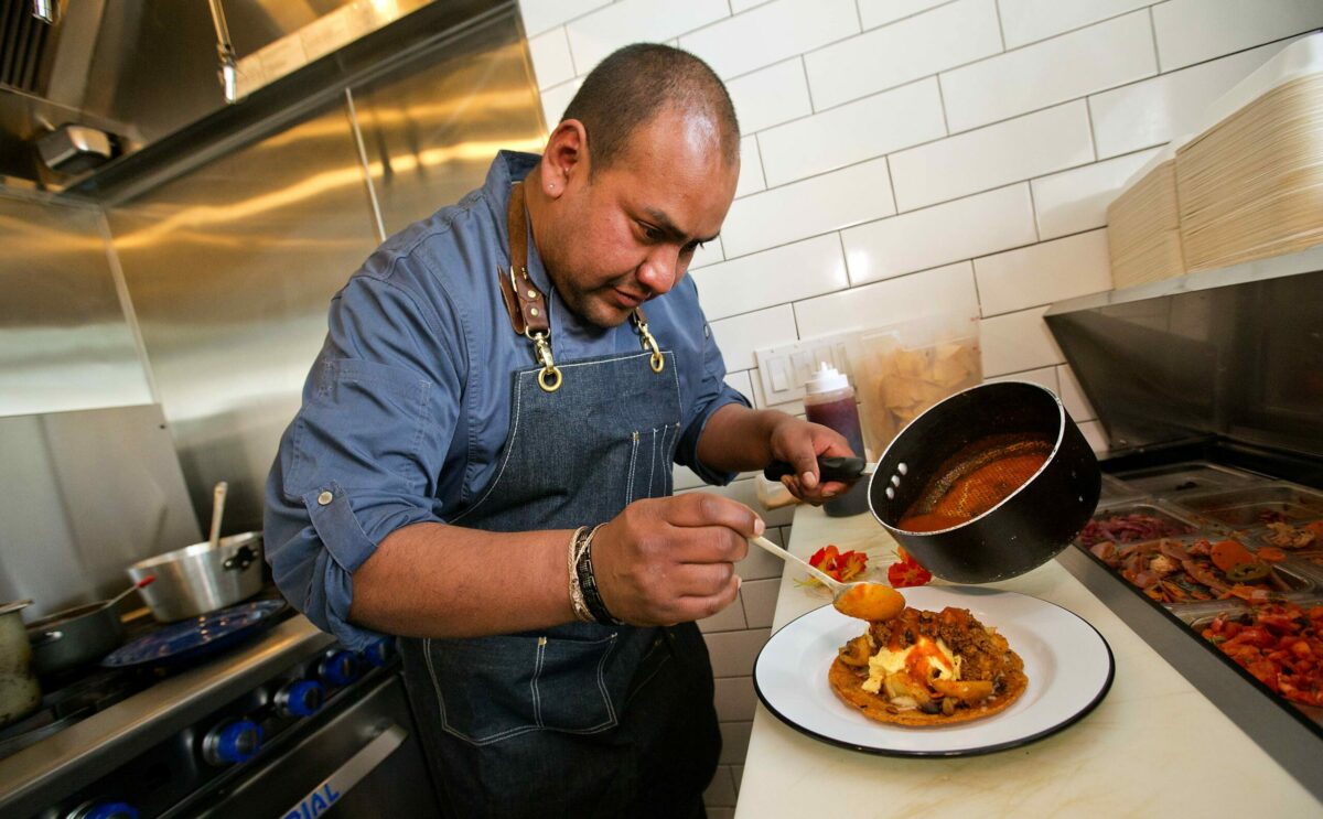Barrio Fresca Cocina Mexicana chef and owner Carlos Rosas prepares the Choriloco, available for Sunday brunch in Sebastopol's The Barlow. (Photo by John Burgess/The Press Democrat)