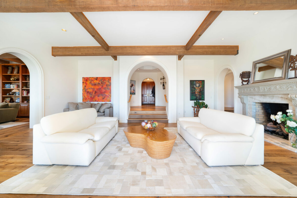 Stained wood doors, beams and floors throughout the home accent the creamy white color scheme. (Ned Bonzi)