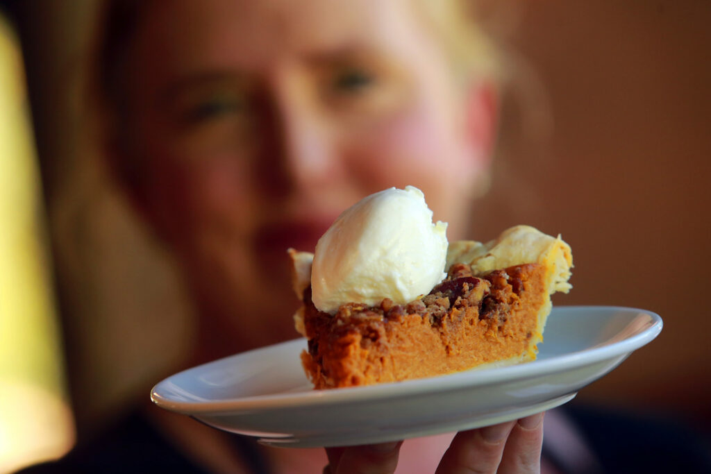 Michele Wimborough with her pumpkin pie with walnut streusel at Hazel in Occidental. (John Burgess / The Press Democrat)